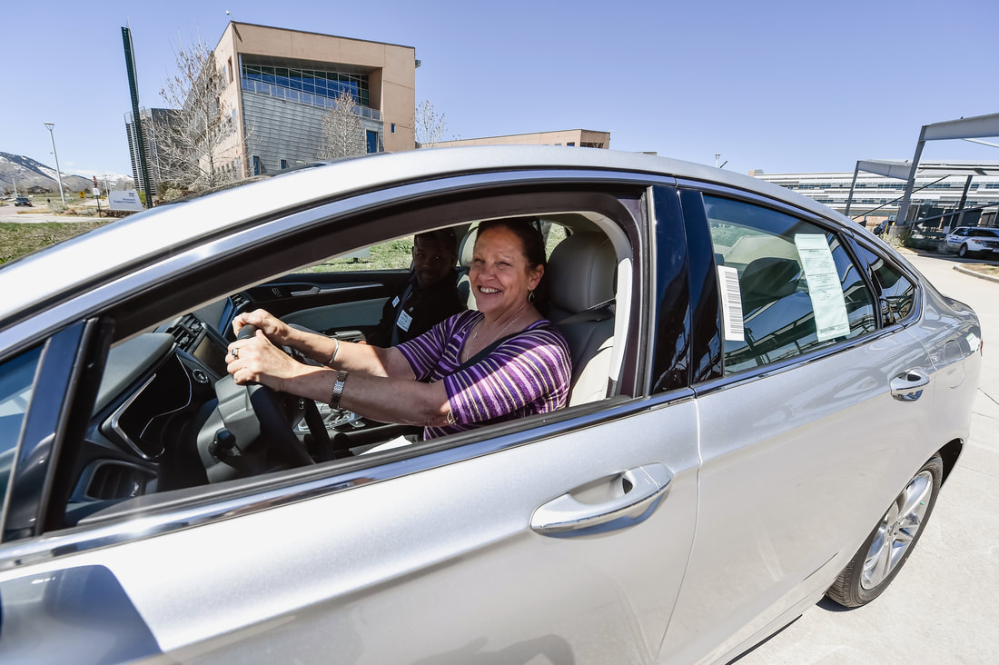 Woman test-driving an electric vehicle