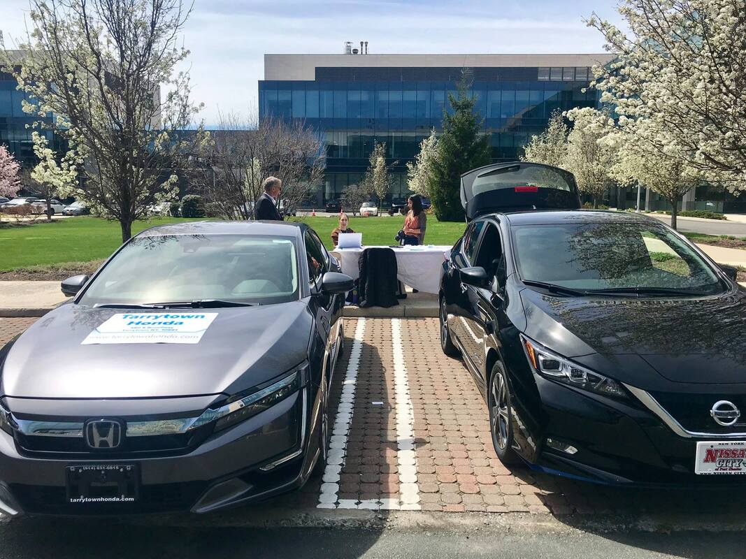 Honda and Nissan displaying electric vehicle models at the Regeneron Electric Vehicle Showcase